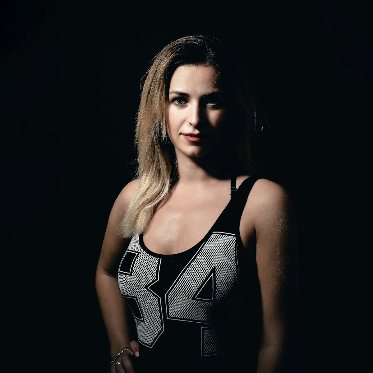 a woman in a sports bra posing for a picture