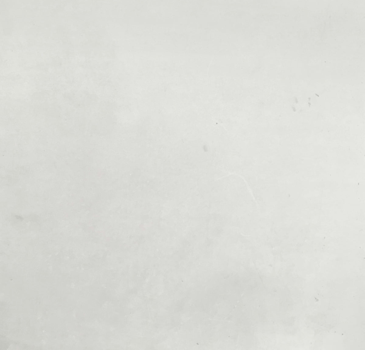 a black and white photo of a person on a surfboard